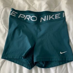 teal nike pros